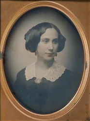 Young Woman Wearing Lace Collar and Brooch