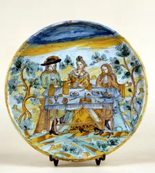 Representation of an outdoor banquet on a ceramic plate of Talavera de la Reina (Spain). Early 16th century. Milan, Museo del Castello.
