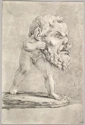 A Child Wearing a Large Mask and Inserting His Hand Through the Mouth