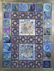 A Favrile glass tile panel, molded with flowers and geometric designs, 20th century