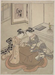 Two Young Women Seated by a Kotatsu Playing Cat