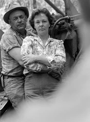Man and woman, husband and wife, embrace and relax at end of work day