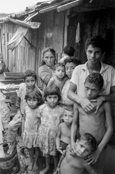 Mother with Ten Children Outside Their Shanty in Mexico