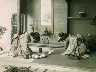 Two Japanese Women in Traditional Costume Greeting Each Other Before the Tea Ceremony, circa 1900 - 1915