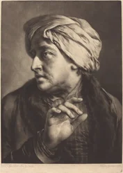 A Man with a Turban and Striped Shirt