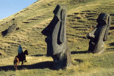 Easter Island monoliths called moai in a volcanic landscape are ancient sentinels