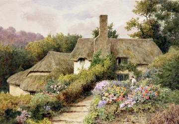 A Cottage at Selworthy, Somerset, England. A Woman in the Garden of an English Country House
