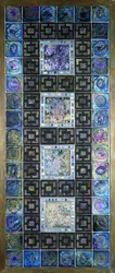 A Favrile glass tile panel, molded with flowers and geometric designs, 20th century