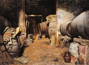 Inner of a cell. Barn with barrels in hay and horse saddle