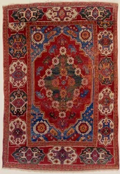 A Transylvanian Rug with Floral Motifs on a Brick Red Background