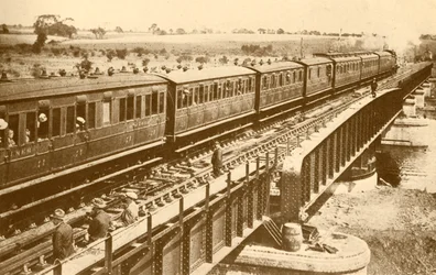 A Train Passing Over The Bridge