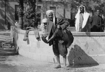 A water carrier in Damascus, Syria