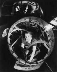 A woman working on a Lancaster bomber, Second World War