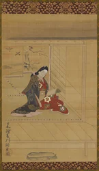 A young woman reading near a screen