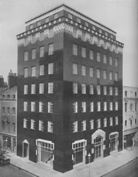 An All-Black Building in London Relieved by a Lace-Like Collar of White, c. 1935