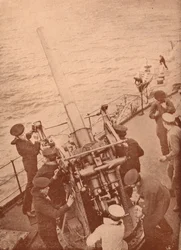 An anti-aircraft gun in action on a British battleship