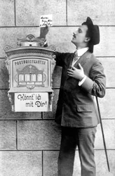 An Elegant Man Posting a Note in a Mailbox, Germany around 1920