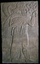 Assyrian relief of a winged figure