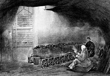 Bottom of a pit shaft in a coal mine with a train of loaded wagons, 1860