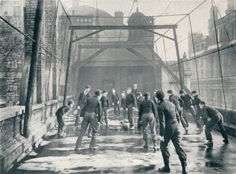 Boys playing football on the roof of St Pauls Cathedral Choir School, London