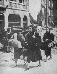 British troops hold out in Louvain as refugees leave the city, 1940