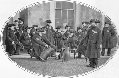 Chelsea Pensioners with black jacks, London, c1901