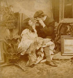 Couple lighting a cigarette from each other, 1900