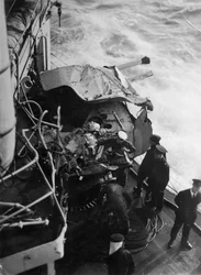 Damaged anti-aircraft gun on the British battleship HMS Malaya, off the coast of Portugal, 1937