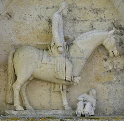 Lateral portal representing Emperor Constantine I the Great symbolizing the Christian displacing paganism, Saint Hilaire church in Melle
