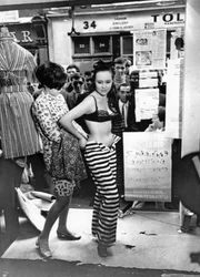 Dressing a model in the window of a boutique