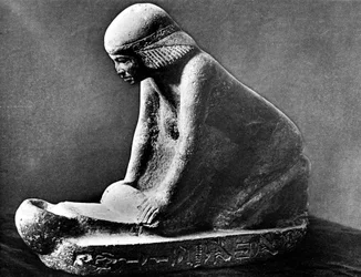 Egyptian Tomb Figure of a Woman Grinding Corn Using a Saddle Quern