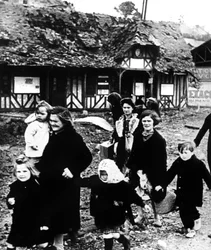 Families Leaving their Village Bombarded during the Normandy Landings, France