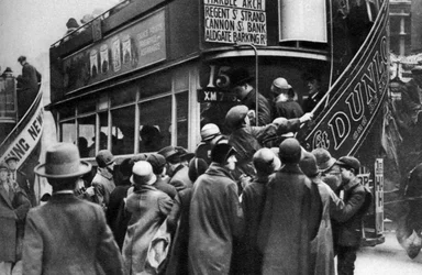 Getting on a bus in Ludgate Hill, London, 1926-1927