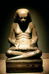 Granite statue of a seated Ancient Egyptian scribe, from Karnak, 18th dynasty, c. 1500 BC