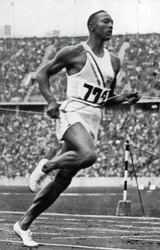 Jesse Owens at the End of the 100m at the Berlin Olympic Games, 1936
