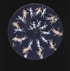 Phenakistiscope disc showing a cupid and two girls, c 1830