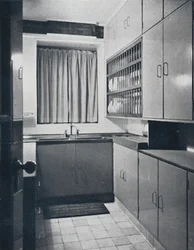 R. W. Symonds and Partner, L. & A.R.I.B.A. - Kitchen: Putty-coloured cellulosed fitments, stainless
