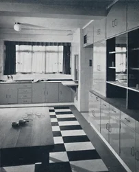 R. W. Symonds and Partner, L. & A.R.I.B.A. - Kitchen: Putty-coloured cellulosed fittings, stainless