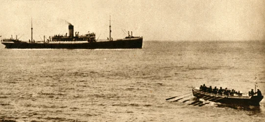 Royal navy cutter about to examine a ship