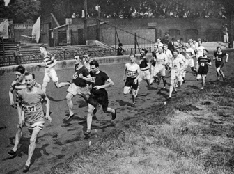 Running the half mile at the Civil Service Sports day, Stamford Bridge, London