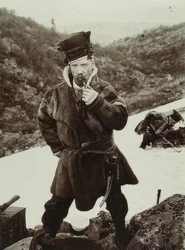 Sweden. Pipe-Smoking Sami with Typical Headgear. Around 1900