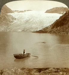 Stream of solid ice Hardanger glacier and lake where it melts, Norway