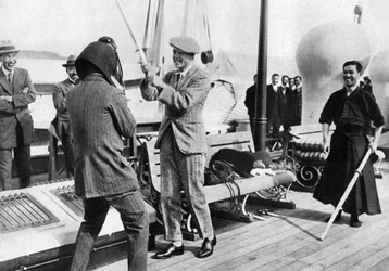 The Prince of Wales Testing a Japanese Fencing Helmet, Japan