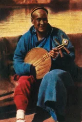 Travelling musician, China, c1928