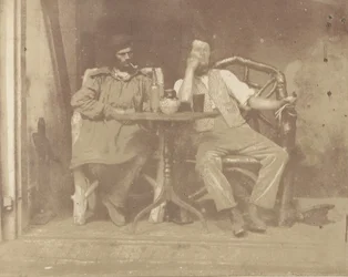 Two Men Seated at a Table