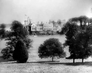 View of building across from fields, c1882