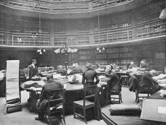 Visitors searching through volumes at the Public Record Office, Chancery Lane, London