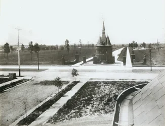 Washington Terrace west from Union Boulevard. First residence under construction beyond gates