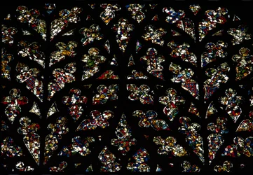 Abstract patterns of fragments of 13th century stained glass in the Bishops eye window, the South rose