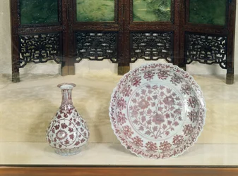 Pear shaped bottle decorated in underglaze red with scrolling chrysanthemum branches, Hung Wu period (1368-98)